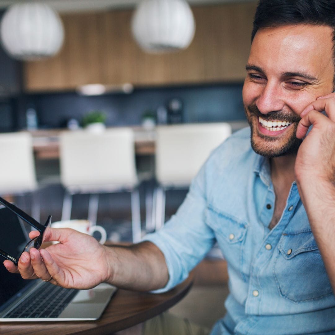 man smiling on phone